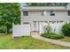 Charming townhouse with a white picket fence and landscaped front yard at 7315 Sandy Creek Dr # 7, Raleigh, NC 27615