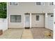 Inviting townhouse entrance featuring a secure screen door and well-maintained walkway at 7315 Sandy Creek Dr # 7, Raleigh, NC 27615