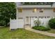 Charming townhouse with a white picket fence and landscaped front yard at 7315 Sandy Creek Dr # 7, Raleigh, NC 27615