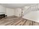Spacious living room features new flooring, white trim, and modern fixtures at 7315 Sandy Creek Dr # 7, Raleigh, NC 27615