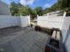 Spacious outdoor patio area with a wooden bench and charming flower boxes at 7315 Sandy Creek Dr # 7, Raleigh, NC 27615