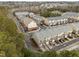 Aerial view of townhomes surrounded by trees showcasing community layout and design at 763 Blossom Grove Dr, Cary, NC 27519