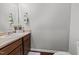 Half bath features vanity with a sink and neutral colored walls at 763 Blossom Grove Dr, Cary, NC 27519