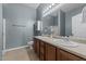 Bathroom features a double vanity, shower, and neutral tile flooring at 763 Blossom Grove Dr, Cary, NC 27519
