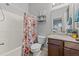 Tub and shower combination, along with vanity and colorful shower curtain at 763 Blossom Grove Dr, Cary, NC 27519