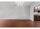 Spacious dining area with hardwood floors, modern lighting, and access to the kitchen at 763 Blossom Grove Dr, Cary, NC 27519