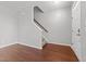 Foyer features hardwood floors, stairs to upper level, and entry door at 763 Blossom Grove Dr, Cary, NC 27519