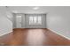 Bright living room with hardwood floors, a large window, and a welcoming entrance at 763 Blossom Grove Dr, Cary, NC 27519