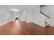 Open living room with hardwood floors, staircase, and plenty of natural light at 763 Blossom Grove Dr, Cary, NC 27519