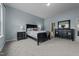 Serene bedroom with a comfortable bed, soft lighting, and a calming color palette at 763 Blossom Grove Dr, Cary, NC 27519