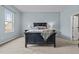 Cozy bedroom with a comfortable bed, stylish bedding, and plenty of space at 763 Blossom Grove Dr, Cary, NC 27519