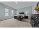 Spacious bedroom with ample natural light, neutral carpet, and coordinating furnishings at 763 Blossom Grove Dr, Cary, NC 27519