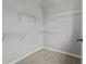 Walk-in closet with shelving features neutral carpet and grey walls at 763 Blossom Grove Dr, Cary, NC 27519