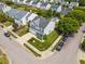 Aerial view of a well-manicured home with a lush green lawn, mature trees, and convenient street parking at 8008 Bright Oak Trl, Raleigh, NC 27616
