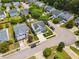 Beautiful aerial view of a home with a well-manicured lawn, mature trees, and convenient street parking at 8008 Bright Oak Trl, Raleigh, NC 27616