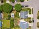 Birds-eye view showcasing the home's roof, manicured lawn, and surrounding landscape in a quiet neighborhood at 8008 Bright Oak Trl, Raleigh, NC 27616