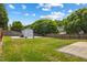 Large, well-maintained backyard featuring a wooden fence, a shed, and a lush lawn at 8008 Bright Oak Trl, Raleigh, NC 27616