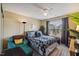 Cozy bedroom with a wooden bed frame and a comfortable-looking teal chair with matching ottoman at 8008 Bright Oak Trl, Raleigh, NC 27616