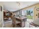 Inviting dining area with a wooden table, chairs, and sliding glass doors to the backyard at 8008 Bright Oak Trl, Raleigh, NC 27616