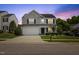 Charming two-story home with gray siding, white trim, attached garage, and a well-maintained front lawn at 8008 Bright Oak Trl, Raleigh, NC 27616