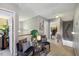 Upstairs hallway featuring a seating area, artwork, and access to other rooms at 8008 Bright Oak Trl, Raleigh, NC 27616