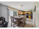 Kitchen with breakfast table and chairs, sliding glass door to the yard, and access to the kitchen's amenities at 8008 Bright Oak Trl, Raleigh, NC 27616