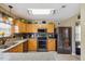 Well-equipped kitchen featuring stainless steel appliances, granite counter tops, wood cabinets, and ample storage space at 8008 Bright Oak Trl, Raleigh, NC 27616