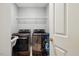 Laundry room with gray walls and equipped with a modern washer and dryer at 8008 Bright Oak Trl, Raleigh, NC 27616