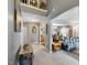 Open-concept living area with gray walls, neutral carpet, high ceilings, and staircase at 8008 Bright Oak Trl, Raleigh, NC 27616