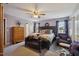 Spacious main bedroom with a king-size bed, dresser, and seating area at 8008 Bright Oak Trl, Raleigh, NC 27616