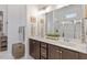 Bathroom with double sink vanity, a large mirror, and tiled shower at 813 Whitley Way, Wendell, NC 27591