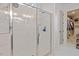Modern bathroom featuring a glass-enclosed shower with white tile and marble flooring at 813 Whitley Way, Wendell, NC 27591