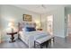 Bedroom with light green walls, wood flooring, and modern decorations at 813 Whitley Way, Wendell, NC 27591
