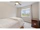Bright bedroom with a ceiling fan, large window, and cozy furnishings at 813 Whitley Way, Wendell, NC 27591