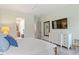 Bedroom with light green walls, wood flooring, and modern decorations at 813 Whitley Way, Wendell, NC 27591