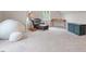 Cozy bonus room with neutral carpet, comfortable seating, and a vintage desk at 813 Whitley Way, Wendell, NC 27591
