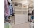 Spacious walk-in closet with custom shelving and drawers for organized storage at 813 Whitley Way, Wendell, NC 27591