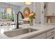 The kitchen features a large island with seating, a sink, and a view of the dining area at 813 Whitley Way, Wendell, NC 27591