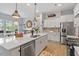 Well-lit kitchen featuring stainless steel appliances, white cabinetry, and a large center island with bar seating at 813 Whitley Way, Wendell, NC 27591