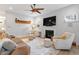 Bright living room with fireplace, ceiling fan, and neutral decor at 813 Whitley Way, Wendell, NC 27591