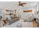 Spacious living room featuring an open floor plan, ceiling fan, and easy access to the kitchen at 813 Whitley Way, Wendell, NC 27591