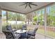 Relaxing screened porch with ample seating and views of the backyard at 813 Whitley Way, Wendell, NC 27591