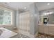 Relaxing bathroom with tub-shower combo, stylish tile floor, and double sink vanity with plenty of counter space at 8904 Milden Hall Ct, Raleigh, NC 27615