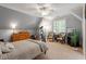 Attic bedroom featuring a bed, dresser, and an exercise bike, with a slanted ceiling at 8904 Milden Hall Ct, Raleigh, NC 27615