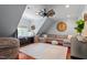 Cozy bonus room featuring a custom window seat, a wooden ceiling fan, and hardwood floors at 8904 Milden Hall Ct, Raleigh, NC 27615