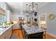 Granite counters, stainless steel appliances, and custom cabinetry enhance this modern kitchen at 8904 Milden Hall Ct, Raleigh, NC 27615