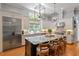 Spacious kitchen features granite countertops, a center island, and stainless steel appliances at 8904 Milden Hall Ct, Raleigh, NC 27615