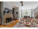 Cozy living room with a fireplace, built-ins, and comfortable seating at 8904 Milden Hall Ct, Raleigh, NC 27615