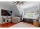 Charming living room features a window seat, plush beanbag, and built in shelves with decor at 8904 Milden Hall Ct, Raleigh, NC 27615