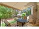 Relaxing covered patio with outdoor seating, overlooking a serene and private backyard at 8904 Milden Hall Ct, Raleigh, NC 27615